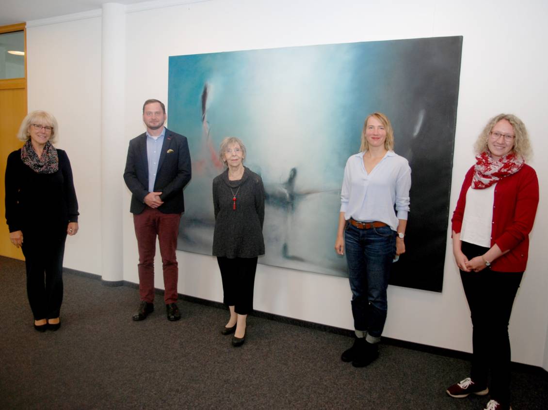 Das Foto zeigt mehrere Personen.