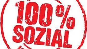 Die Grafik zeigt einen Stempelabdruck mit der Aufschrift "AUCH KOMMUNAL 100 % SOZIAL":